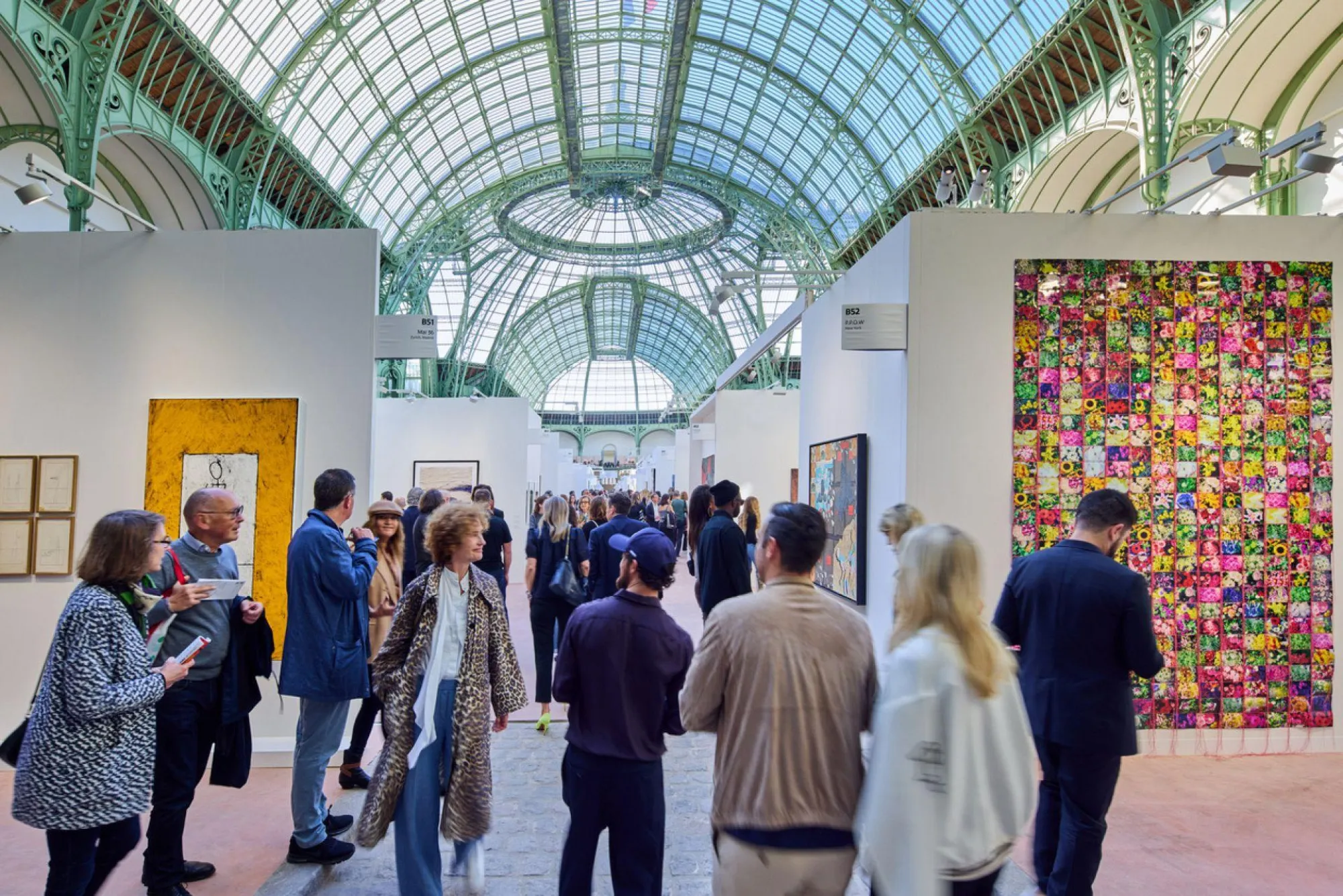Gallery booths under the Grand Palais glass roof at Art Basel Paris
